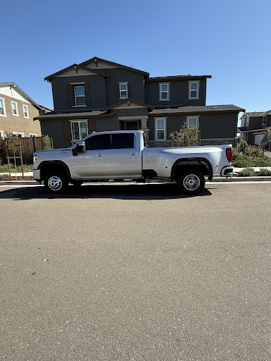 Silver GMC Sierra dually after a full detail
