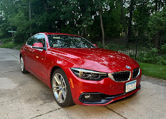 Red BMW coupe after ceramic coating application